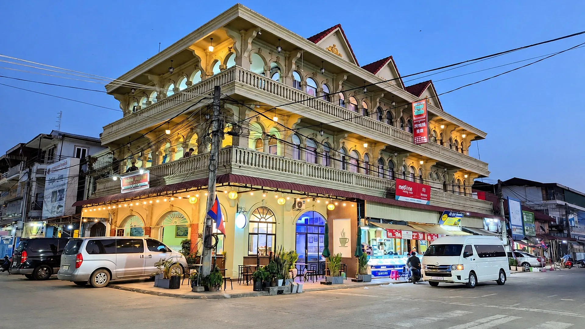 Sampheap Guesthouse building lit up in the evening in Stung Treng, Cambodia